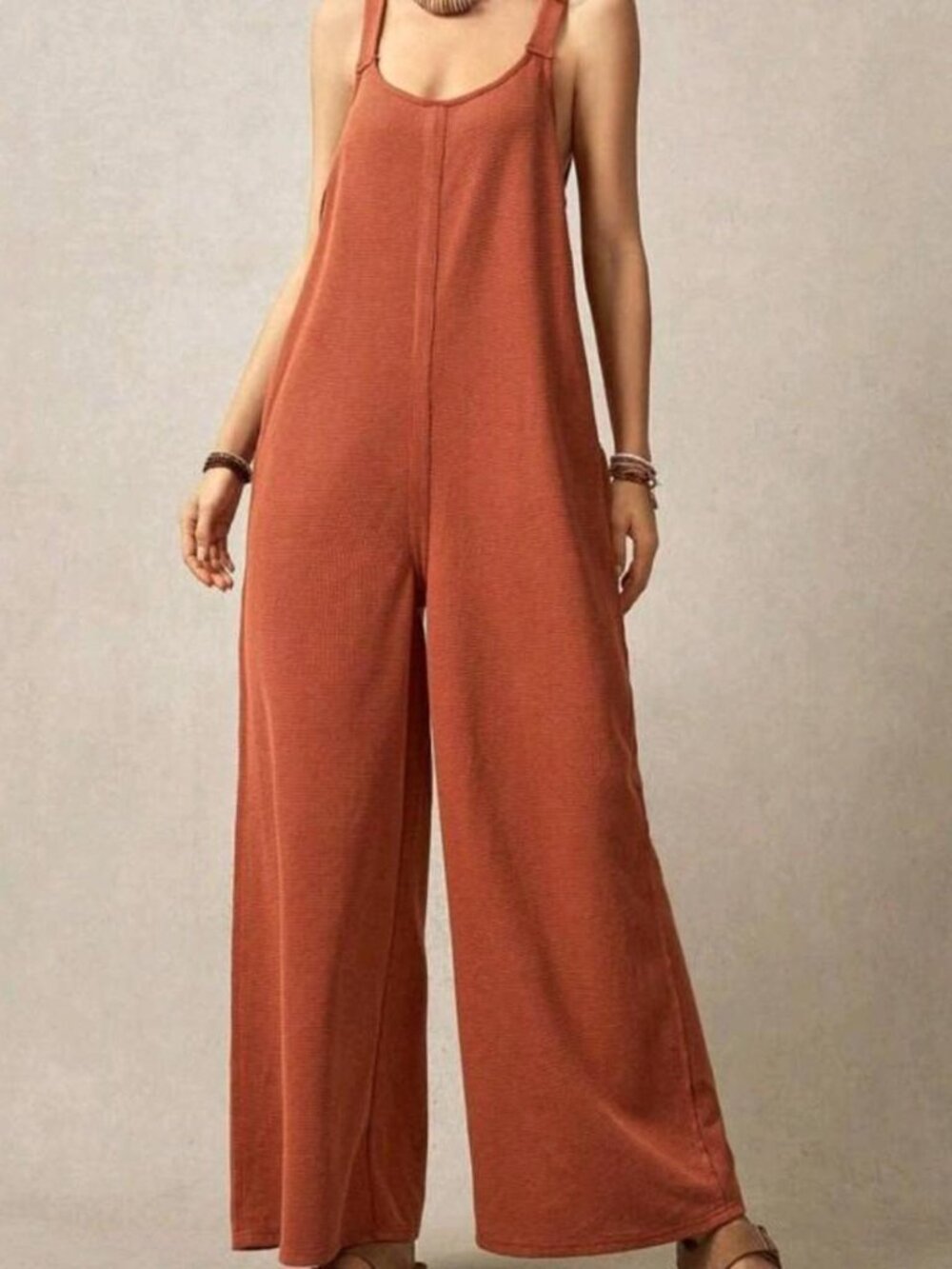 burnt / rustic orange jumpsuit with wide leg and open back